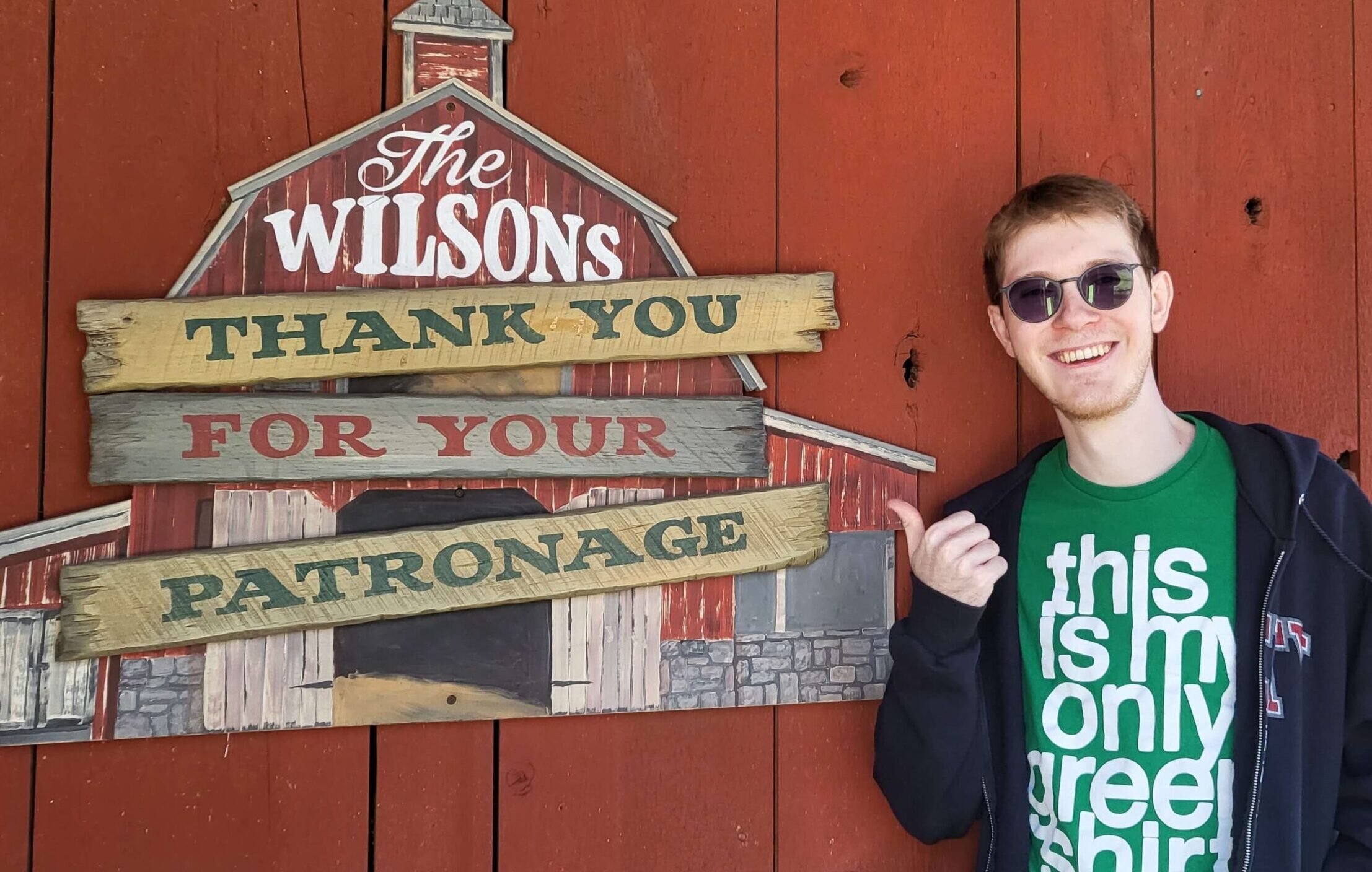 Justin Wilson pointing at a sign at the Silver Dollar City theme park